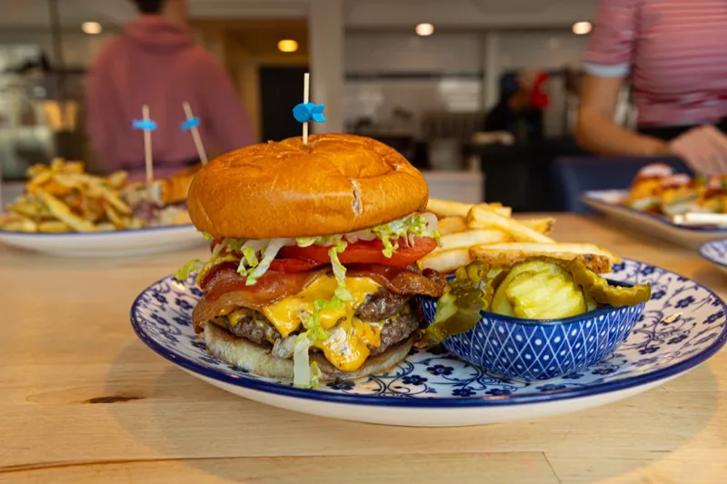 Smash burger with bacon, cheese and fries at Salty Days